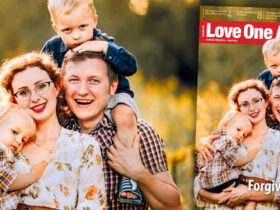 A happy family against the backdrop of a meadow. Love One Another 3-2026