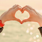 a heart shape made with fingers