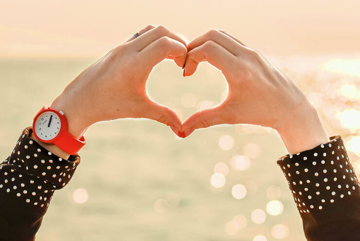 a heart shape made with fingers