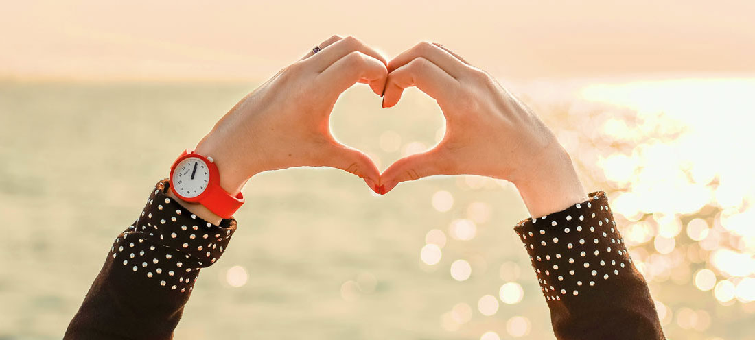 a heart shape made with fingers
